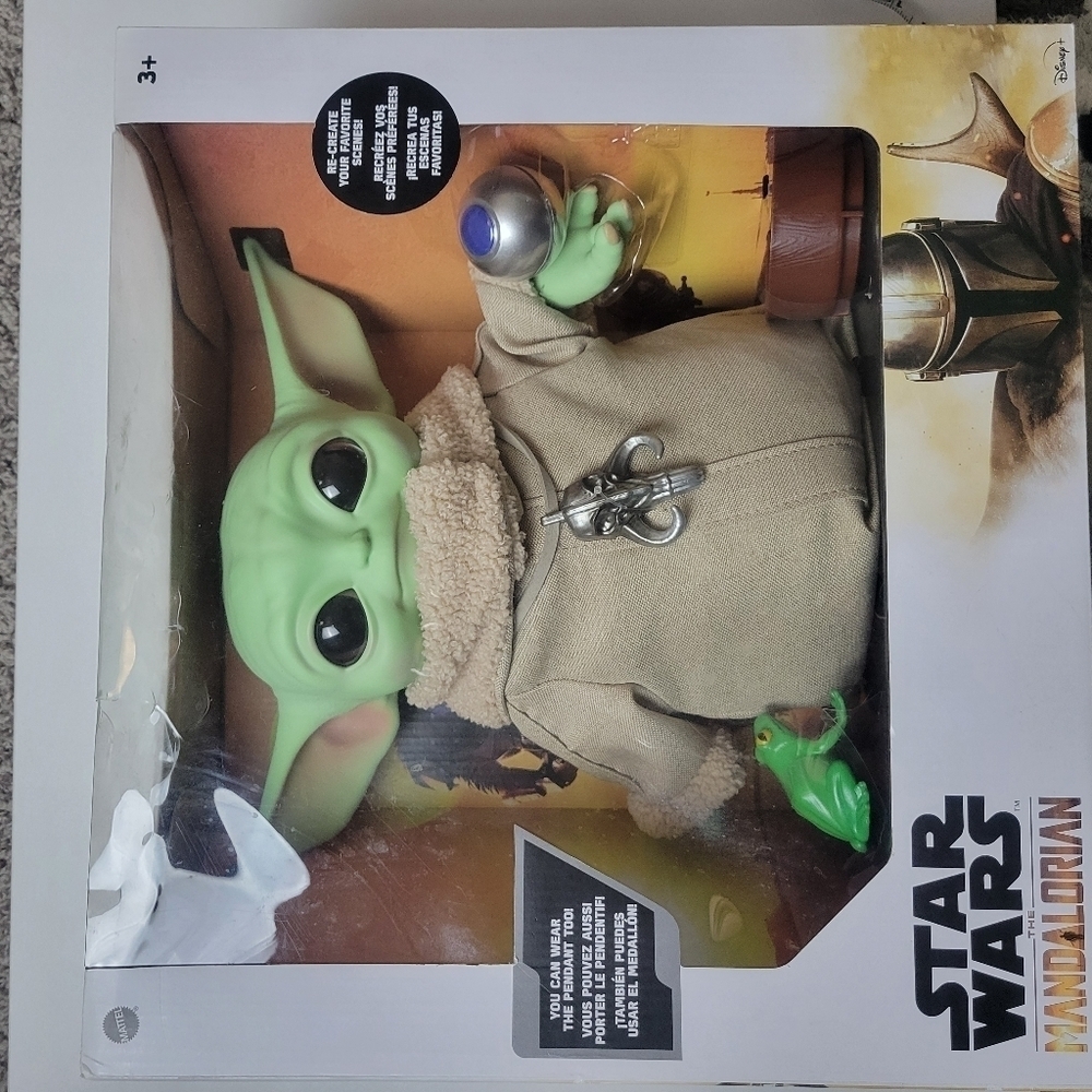 Mandalorian toy with accessories grogu